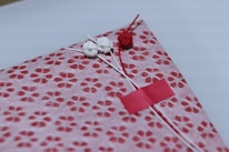 Close-up of beautifully wrapped emotional gift packs with delicate ribbons.