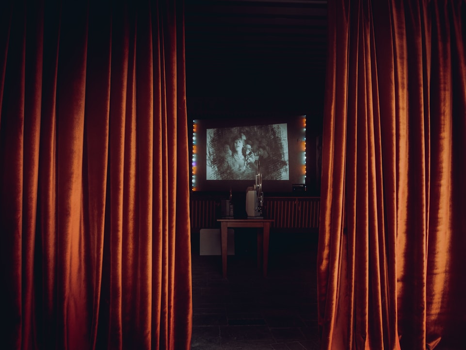 a room with a window and curtains