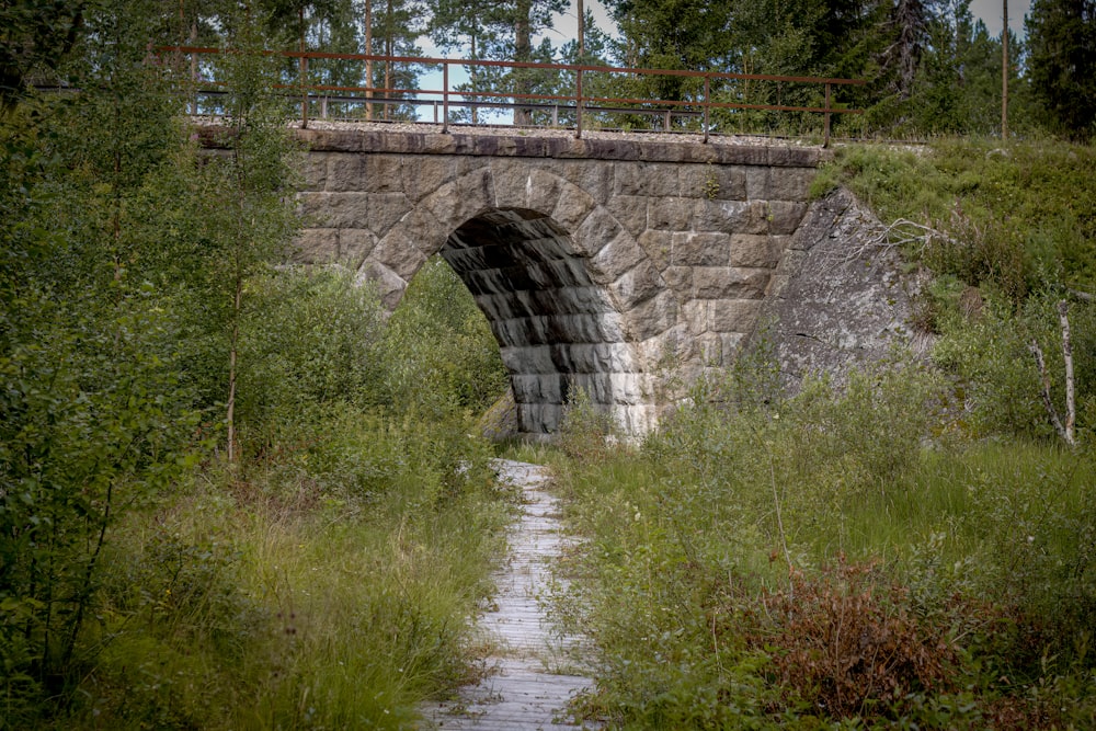 a stone bridge over a river