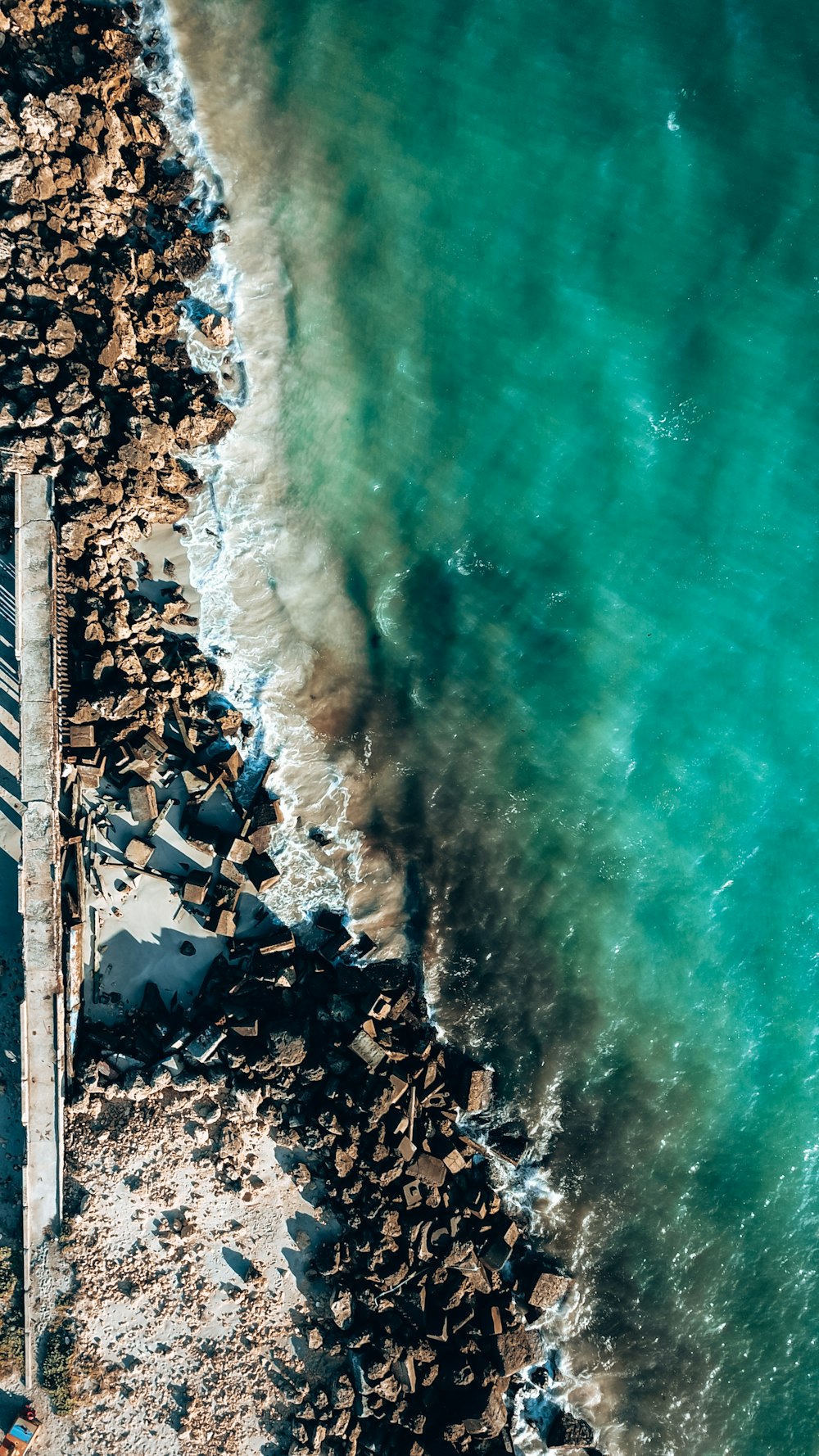 a group of people standing on a beach