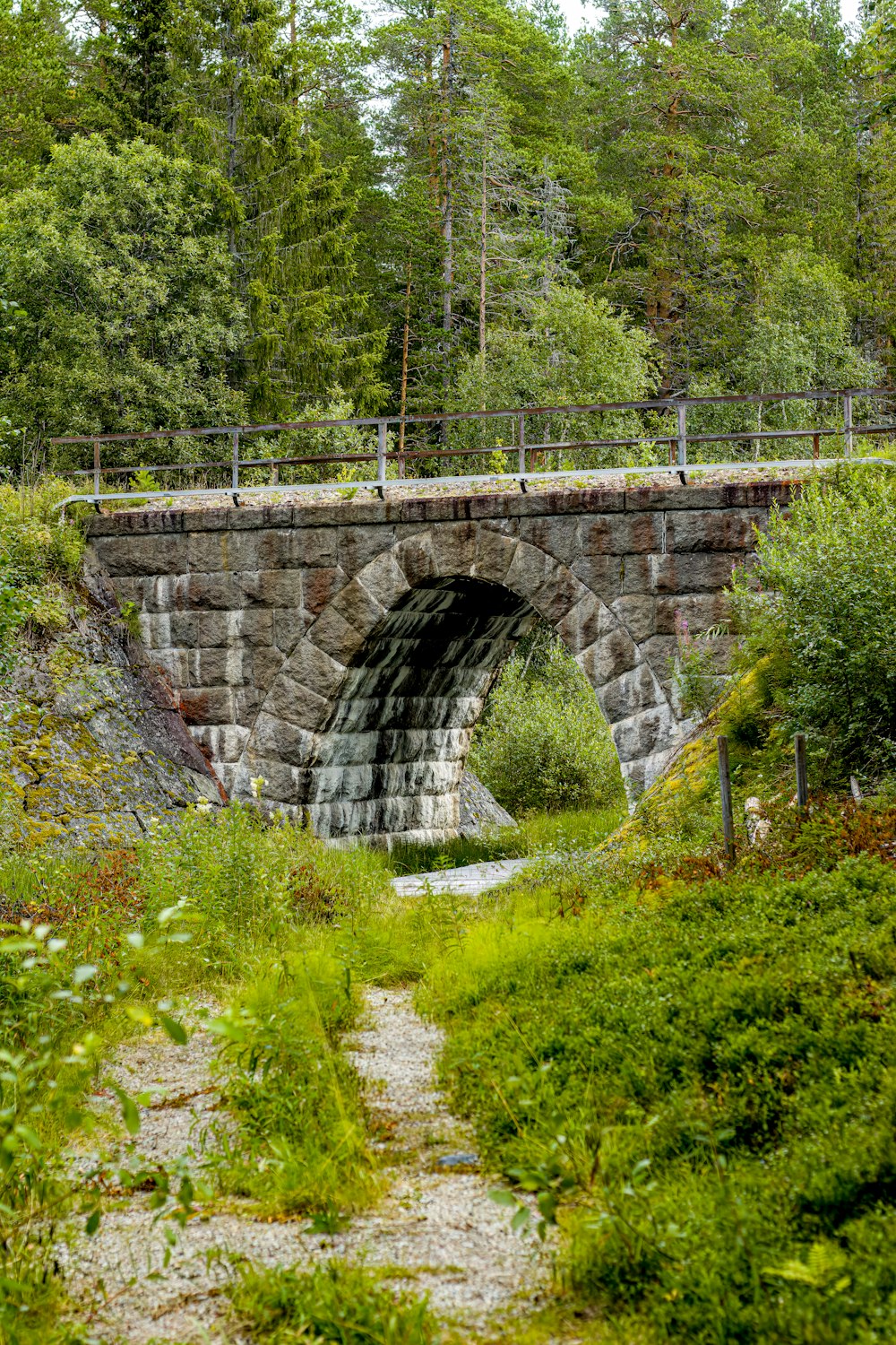 a stone bridge over a river