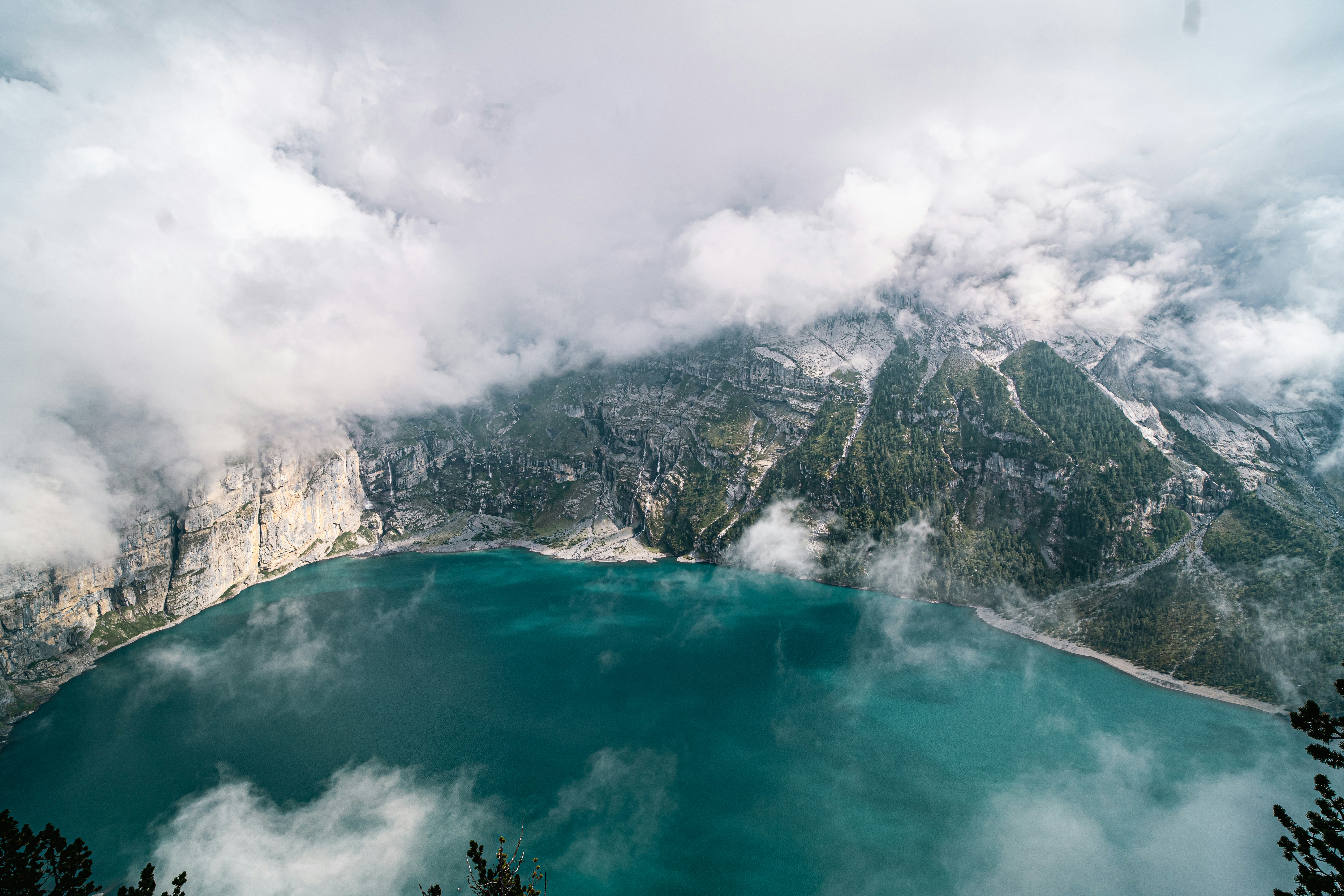 a body of water with mountains in the background