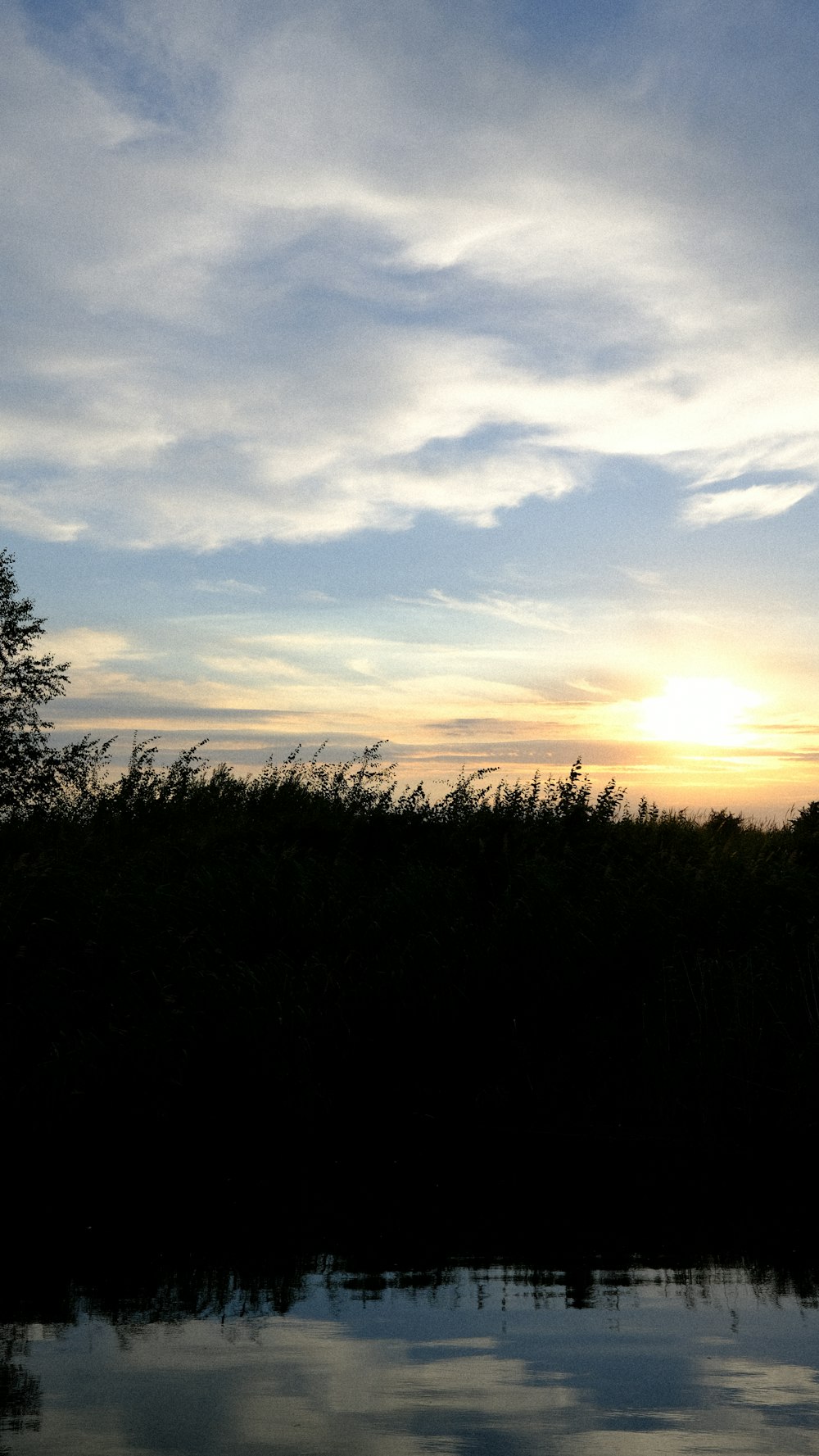 a sunset over a lake