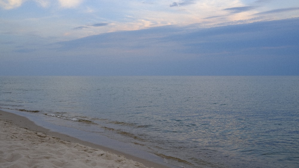 a beach with a body of water