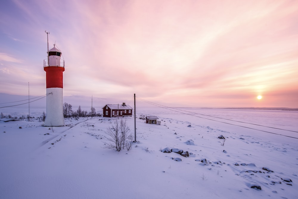 a lighthouse in a snowy environment