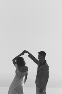 a man and woman holding hands