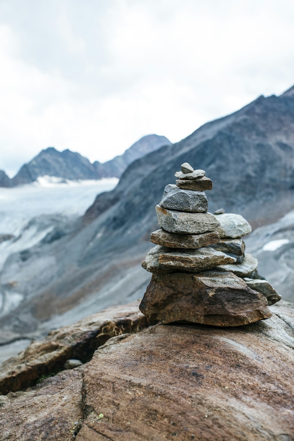 a stack of rocks on a mountain