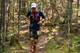 a man running in the woods