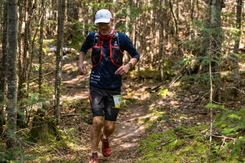 a man running in the woods