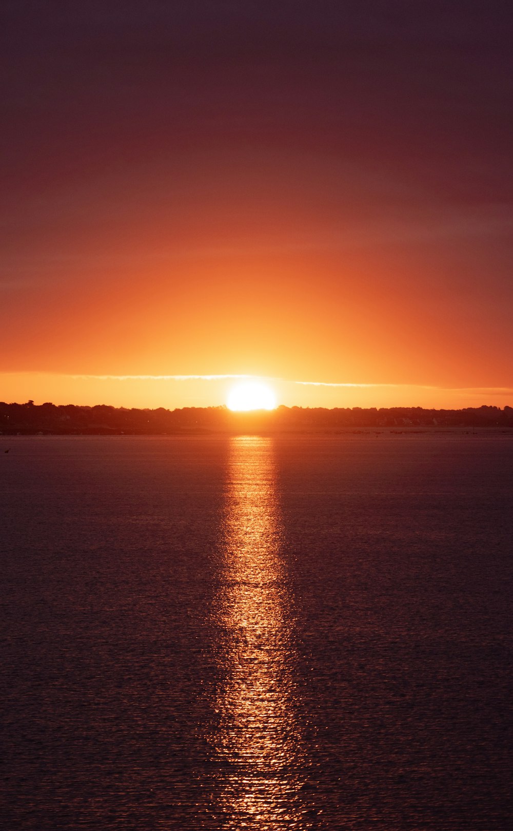 a sunset over a body of water