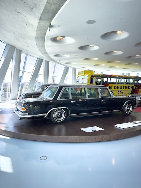 A shiny white stretch limousine gleaming under soft lighting
