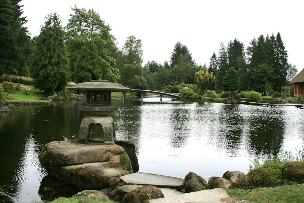 a pond with a bridge over it