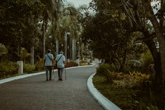 a couple walking down a sidewalk
