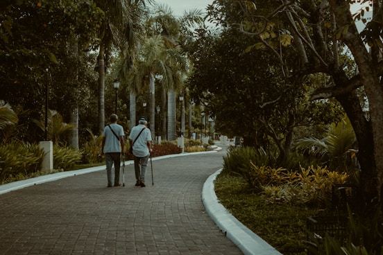 a couple walking down a sidewalk