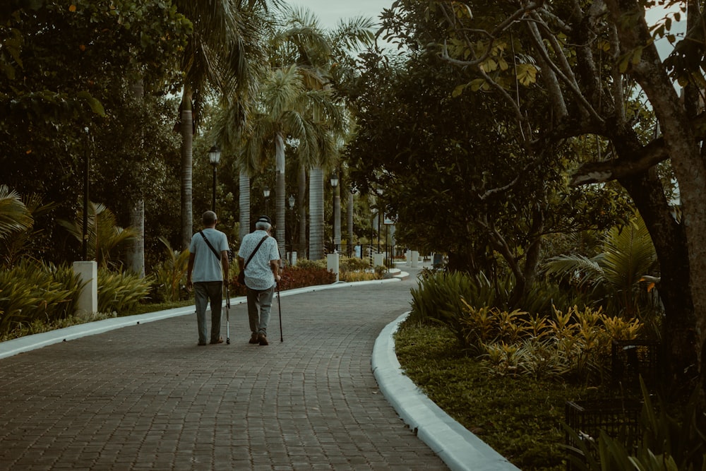 a couple walking down a sidewalk