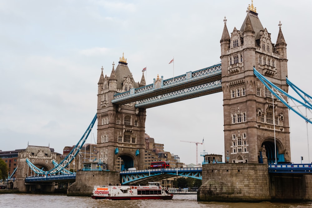 a bridge with a boat underneath