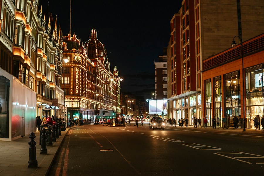 City street at night lined with lit buildings, placeholder display image