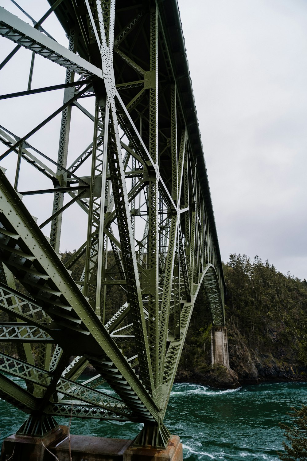 a large metal bridge over water