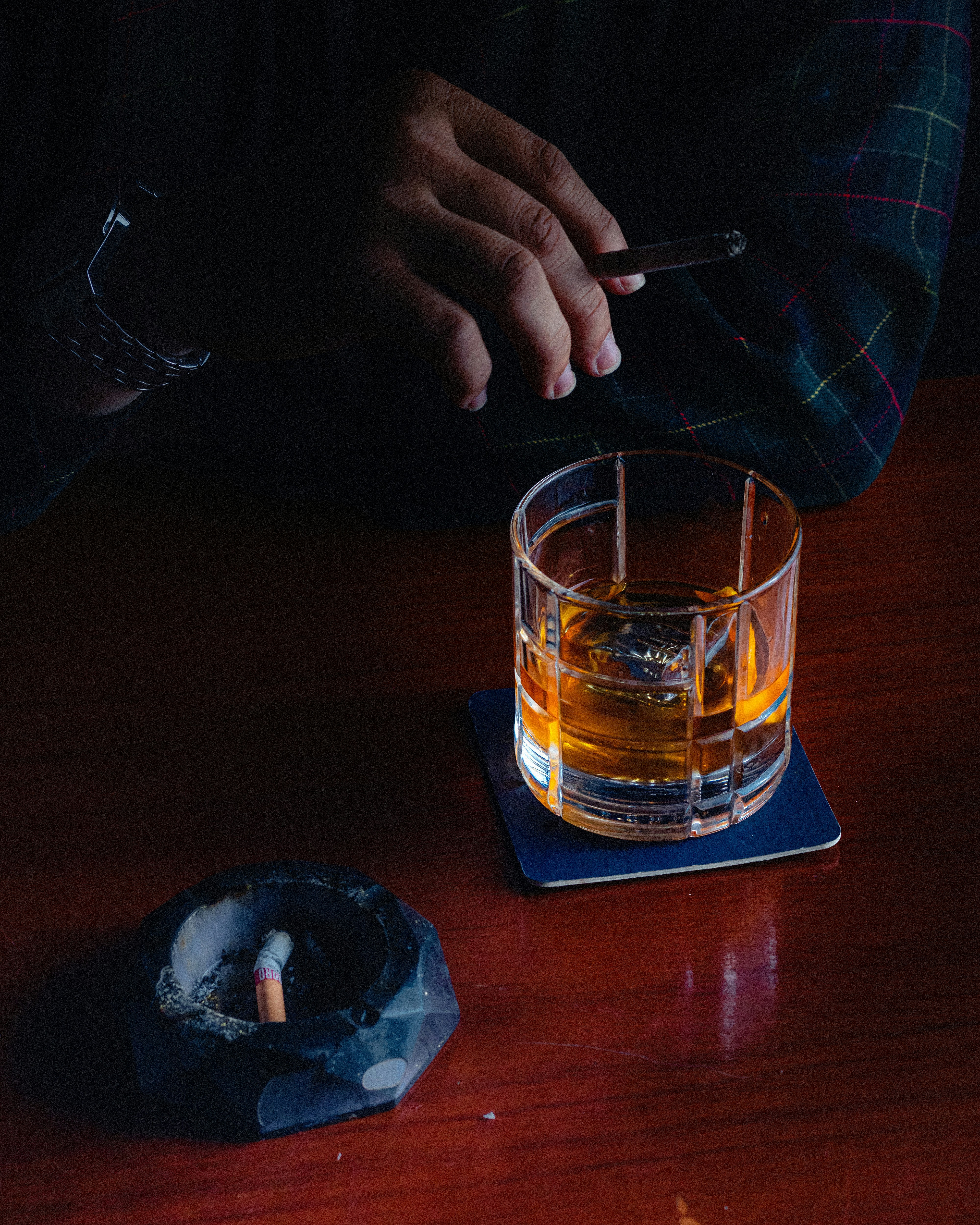 A display of premium whiskey and spirits at La Padrona, a stylish new Italian restaurant in Boston's Back Bay neighborhood. Warm, elegant atmosphere with a modern design.