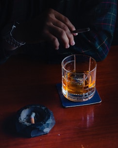 a person lighting a cigarette