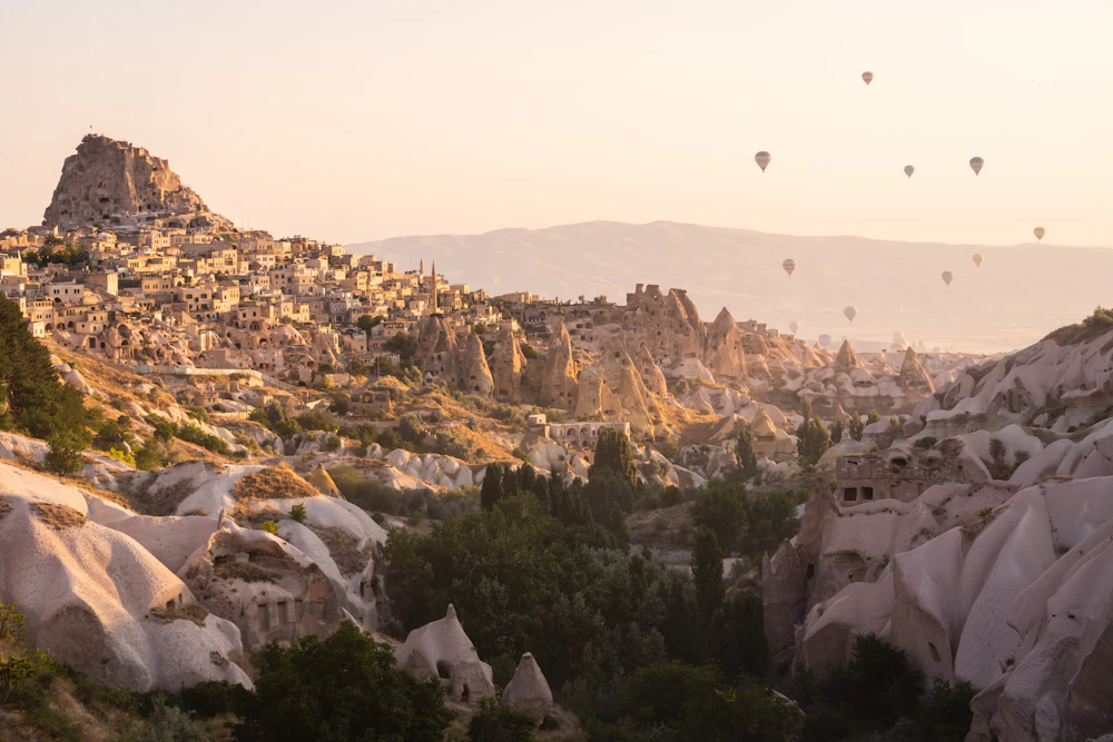 Cappadocia's stone houses and dramatic rock formations in morning light