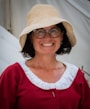 a person wearing a hat and glasses