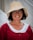 a person wearing a hat and glasses