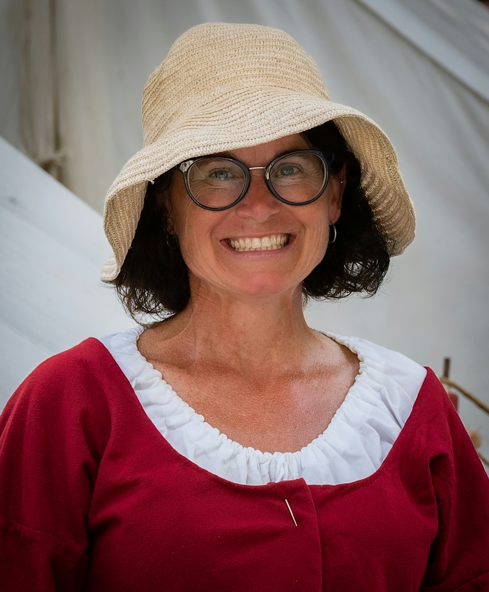 a person wearing a hat and glasses