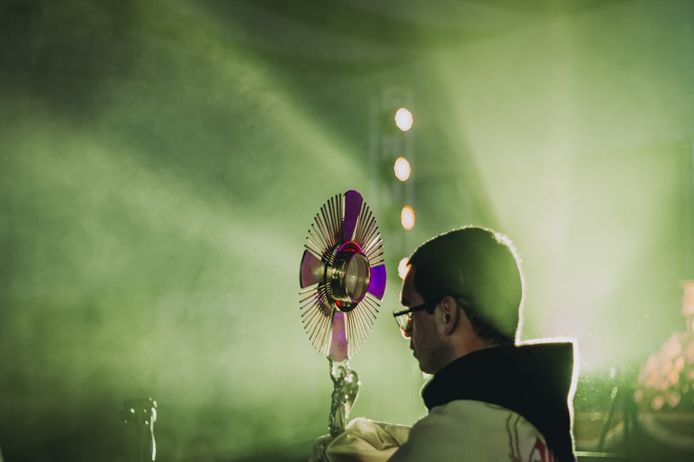 a person looking at a flower