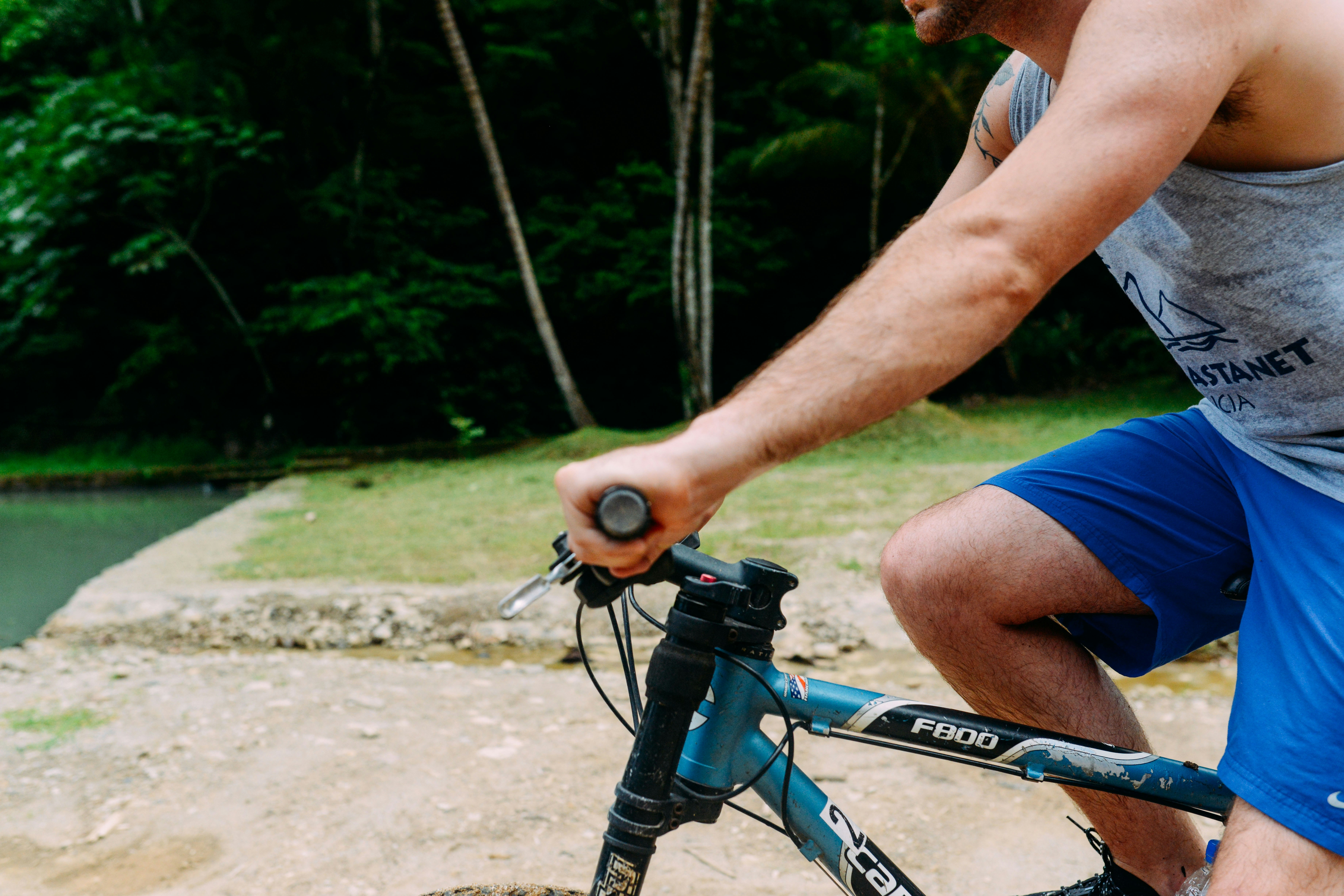 a man riding on the back of a bicycle