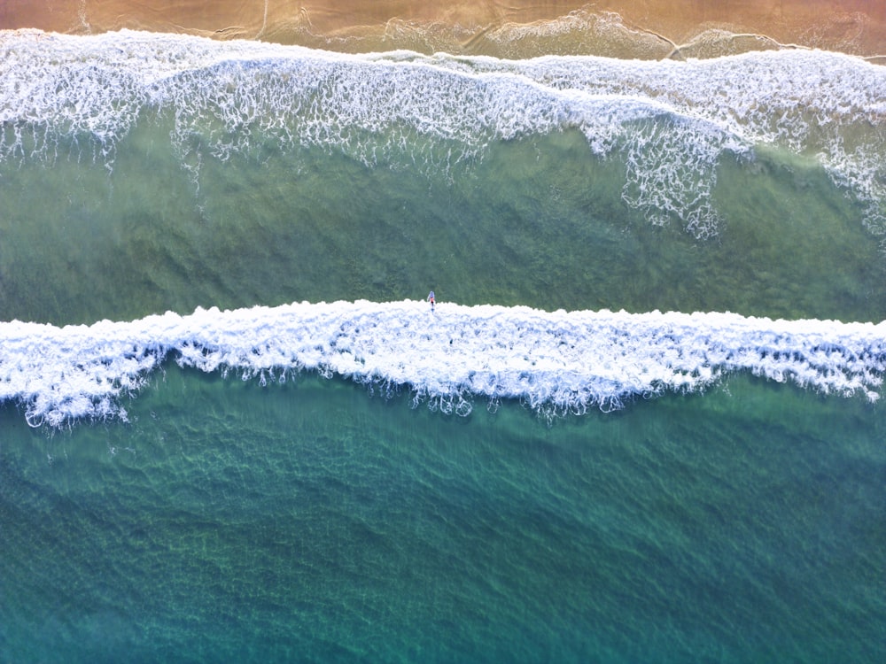 a person standing on a wave