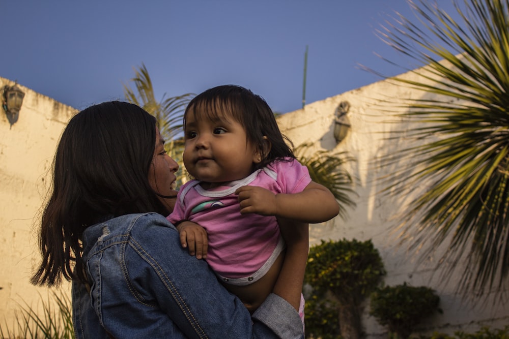 a person holding a baby