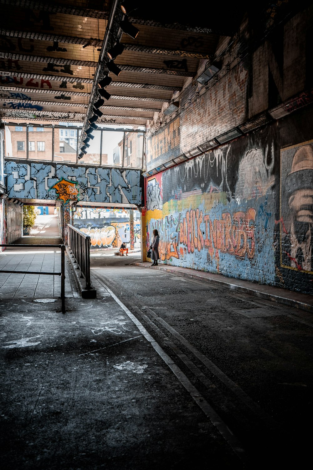 a person walking in a tunnel