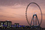 a ferris wheel at sunset