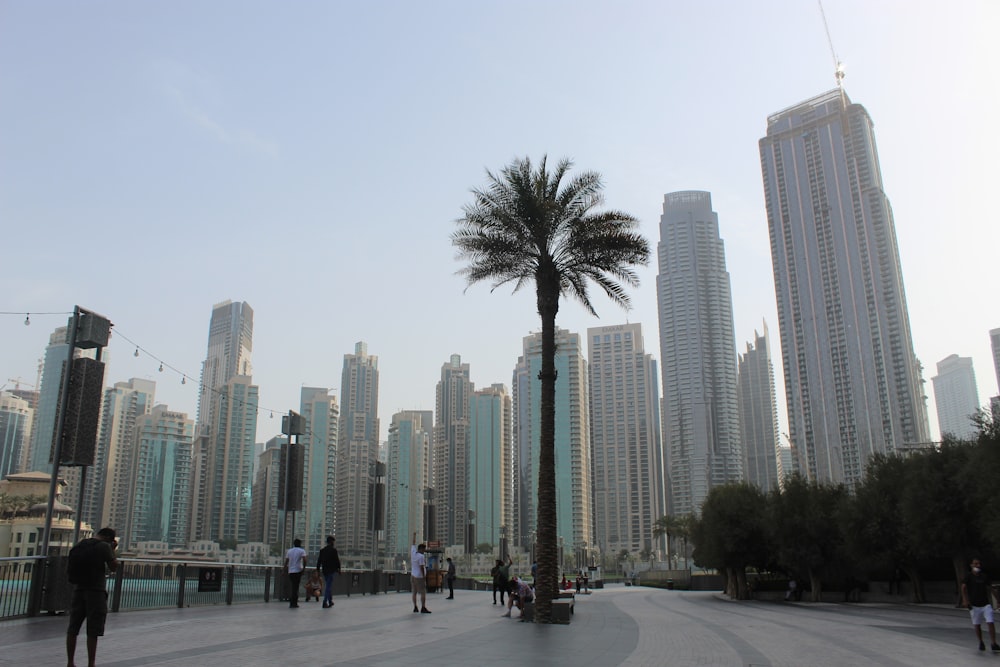 a group of people walking in a city