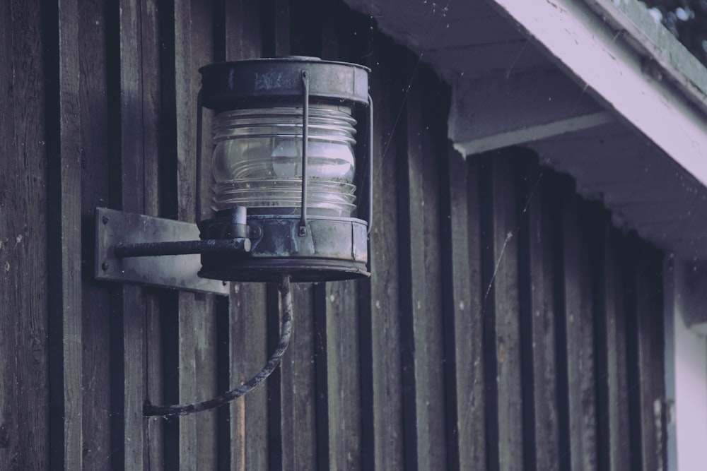 a metal object on a wooden wall