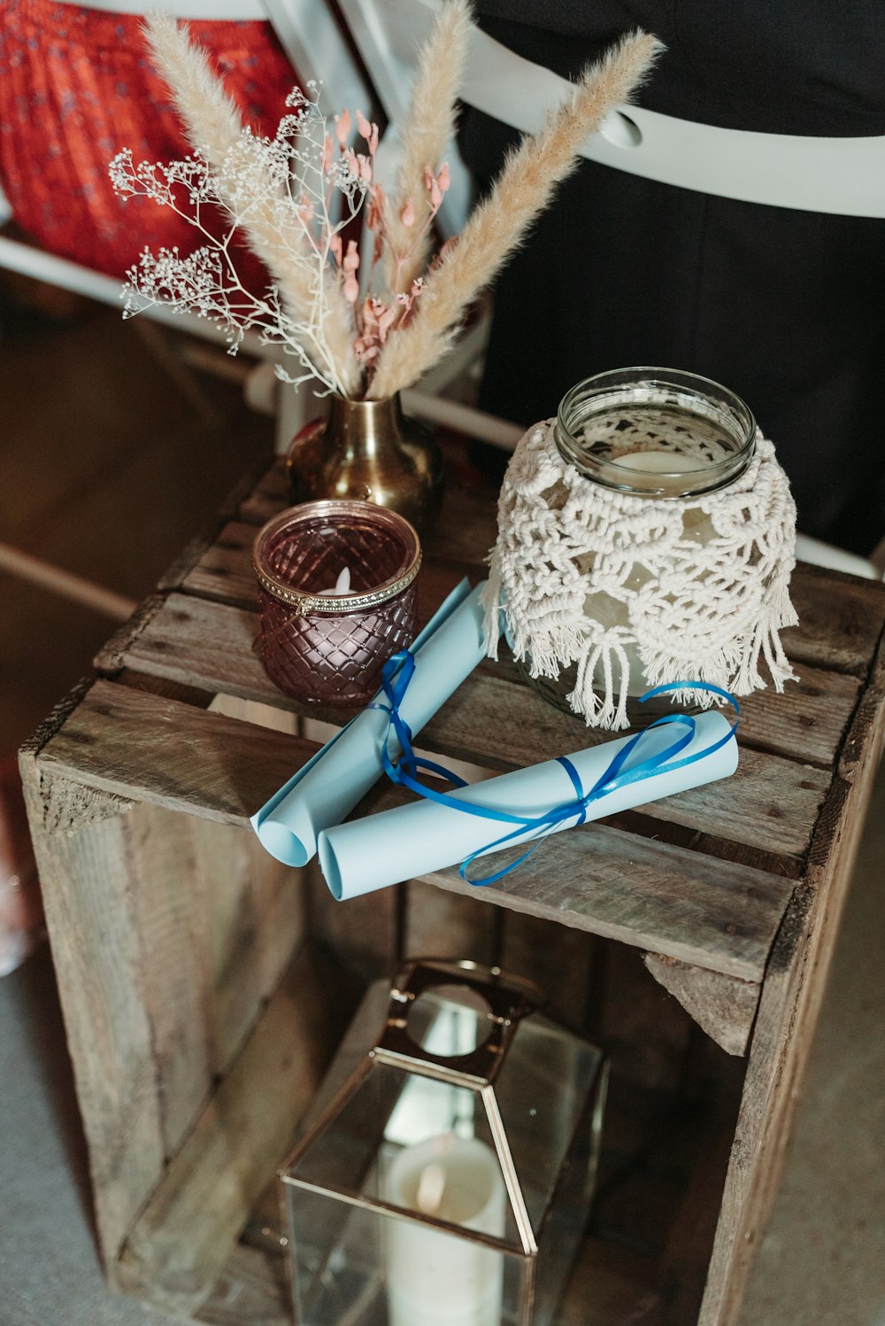 a vase with flowers and a pair of scissors on a table