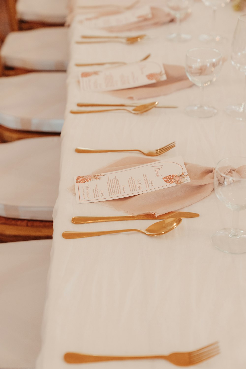 a table with a white table cloth and a white table cloth with a white table cloth and a