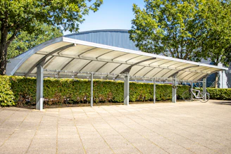 a covered area with a bike rack