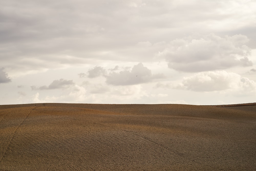 a large flat plain with clouds