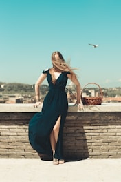 a person in a dress holding a basket