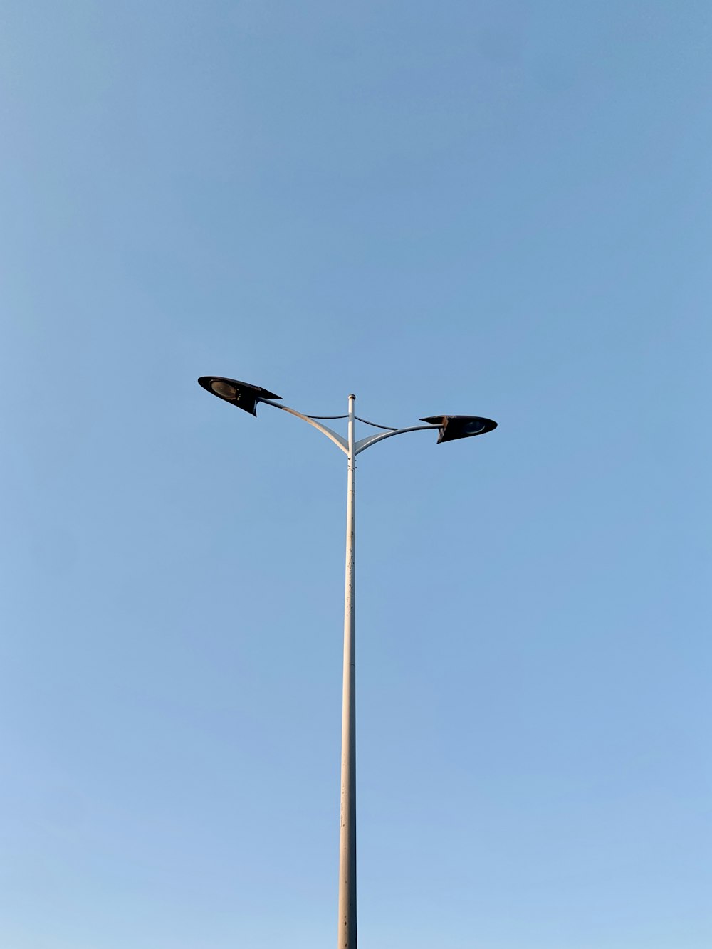 a street light with a blue sky