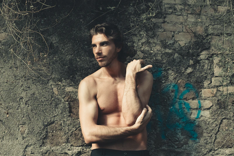 shirtless man with confident physique