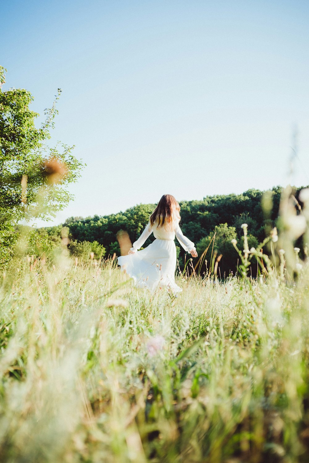 a person walking through tall grass