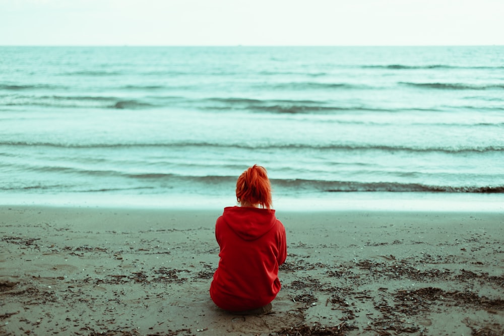 a child sitting on a beach