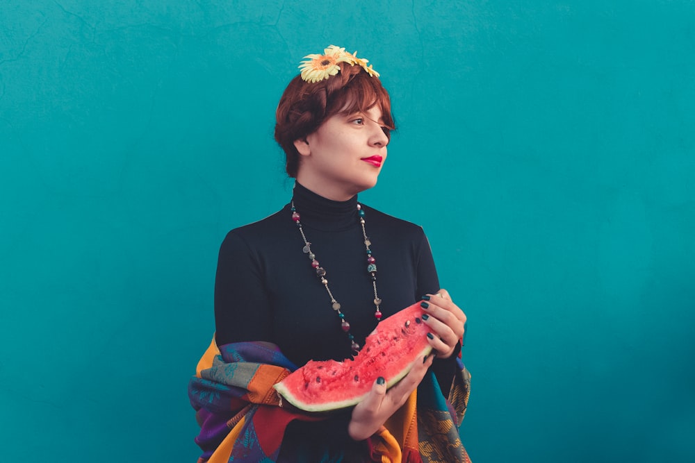 a woman holding a heart shaped object