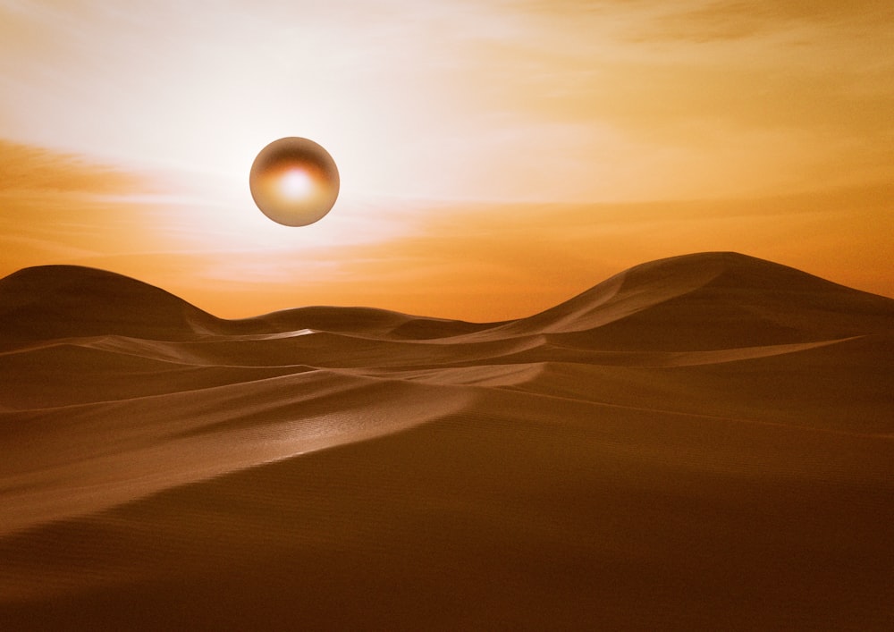 a desert landscape with the sun setting