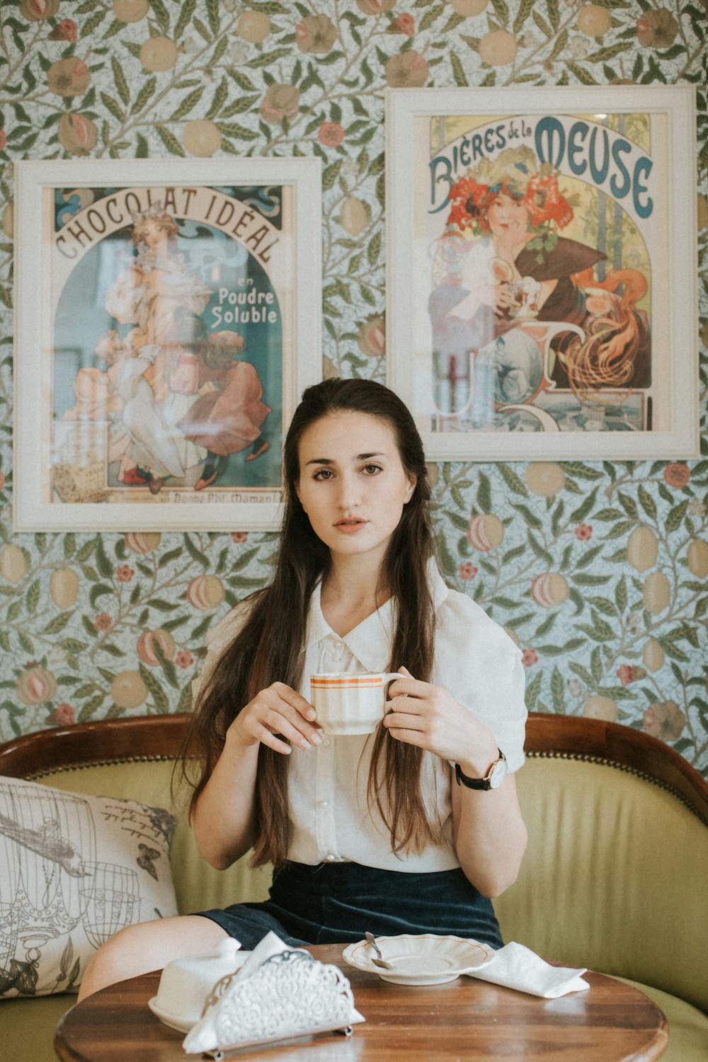 a woman sitting on a couch