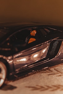 Close-up of a shiny, freshly cleaned car interior with vibrant orange accents.
