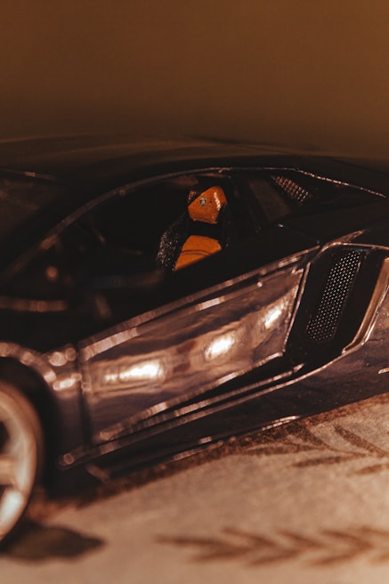 A close-up of a sleek, colorful sports car's interior.